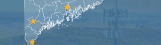 State of Maine with counties outlined; a star locating Bucksport, Naples, and Ogunquit; a cell tower