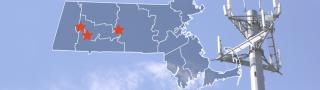 The State of Massachusetts, with outlined county boarders; a cell tower.