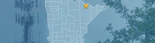 The state of Minnesota, with outlined county borders and a star locating the Kabetogama State Forest; a cell tower and tree
