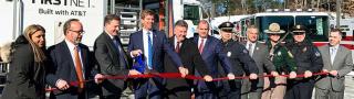 Ed Parkinson of the FirstNet Authority and New Hampshire Governor Chris Sununu cut a red ribbon at the launch of several FirstNet towers