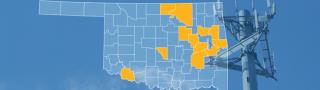 The state of Oklahoma, with outlined county borders; a cell tower