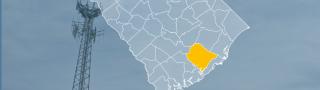 The state of South Carolina, with outlined county borders; a cell tower.