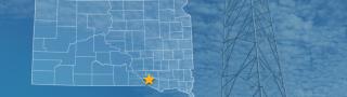 The state of South Dakota, with outlined county borders and a star locating Yankton Sioux Reservation, South Dakota; a cell tower.