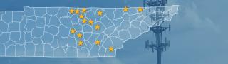 The state of Tennessee, with outlined county borders and 15 stars locating towns; a cell tower.