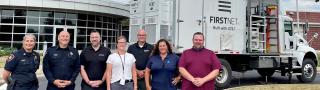 Winnebago County Sheriff’s Office, FirstNet Authority and FirstNet Built with AT&T and AT&T personnel in front of a SatCOLT outside.