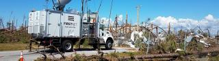 An AT&T SatCOLT is set up among damage from Hurricane Michael