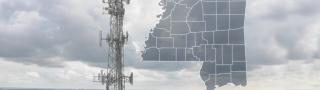 The State of Mississippi, with outlined county borders; a cell tower.