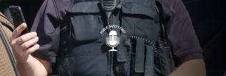 Law enforcement officer holds smartphone in hand; Public Safety First podcast logo