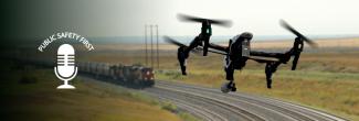 Drone flying over moving train 