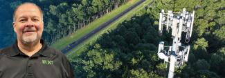 In the background, a rural road cuts through a dense forest with a cell tower rising above the treetops; on the left, West Virginia Department of Transportation Assistant Secretary Scott Eplin smiles.