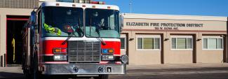 A fire truck parked in front of the Elizabeth Fire Protection District station.