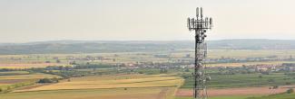 "Expanding rural broadband coverage through FirstNet;" A cell tower located in a rural farm town