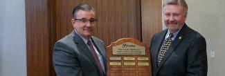 John Stevens receives the Chief Harlin R. McEwen Public Safety Broadband Communications Award from Board Vice Chair Richard Carrizzo 