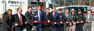 Ed Parkinson of the FirstNet Authority and New Hampshire Governor Chris Sununu cut a red ribbon at the launch of several FirstNet towers