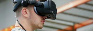 Man wearing a virtual reality headset in the Public Safety Immersive Test Center