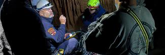 Virginia Communications Cache personnel testing communications inside a cavern