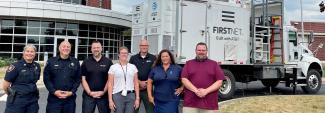 Winnebago County Sheriff’s Office, FirstNet Authority and FirstNet Built with AT&T and AT&T personnel in front of a SatCOLT outside.