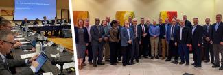 FirstNet Public Safety Advisory Committee members discuss matters during a meeting, Twenty-three representatives of all disciplines of public safety stand for a PSAC group photo