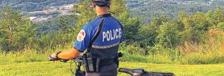 Signal Mountain officer on a bike looking at mountain