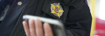 Elbert County Sheriff Norton holding a FirstNet-enabled phone