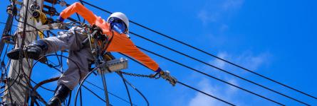 A powerline worker repairing electrical wires