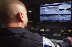 An male officer with the Richmond (Va.) Police Department monitors information n a computer screen.